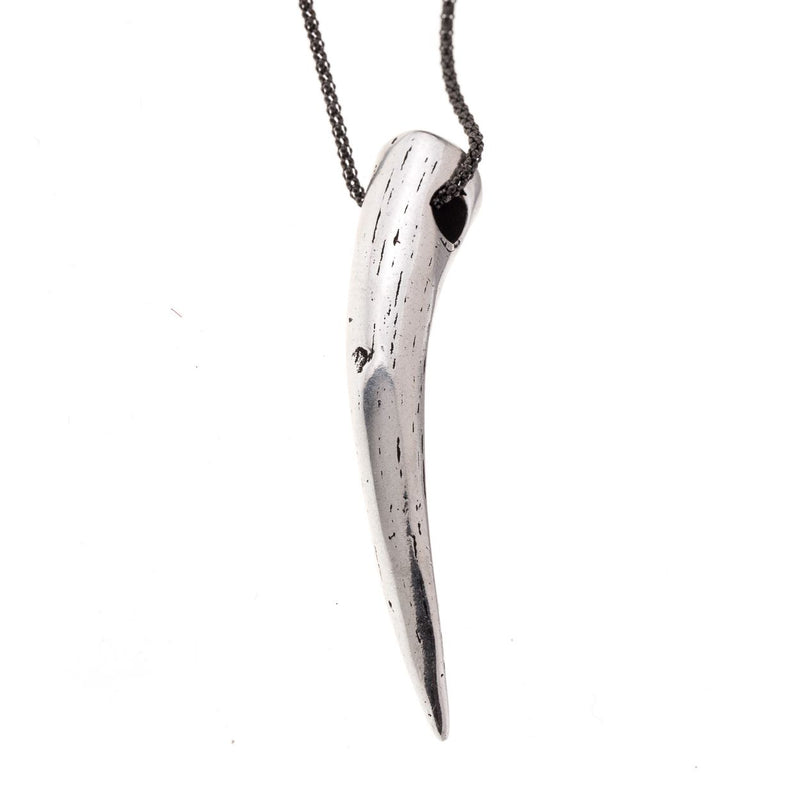 Detail of tusk pendant in steel color