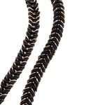 Detail of grade masai type necklace with black and gold links
