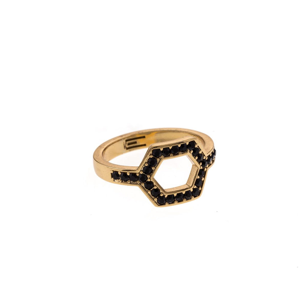 Hexagonal ring with gold colored stones
