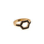 Hexagonal ring with gold colored stones