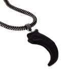 Original pendant with tusk finished in black resin